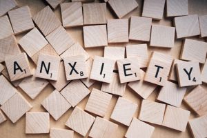 scrabble tiles spelling the word anxiety